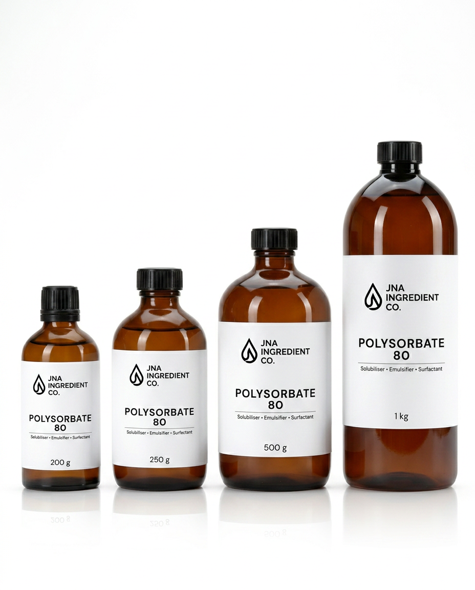 JNA Ingredient Co showcasing four amber glass bottles of Polysorbate 80 in graduated sizes, arranged from smallest to largest on a white background with a soft reflection for emulsifying, dispersing, and stabilising skincare formulations