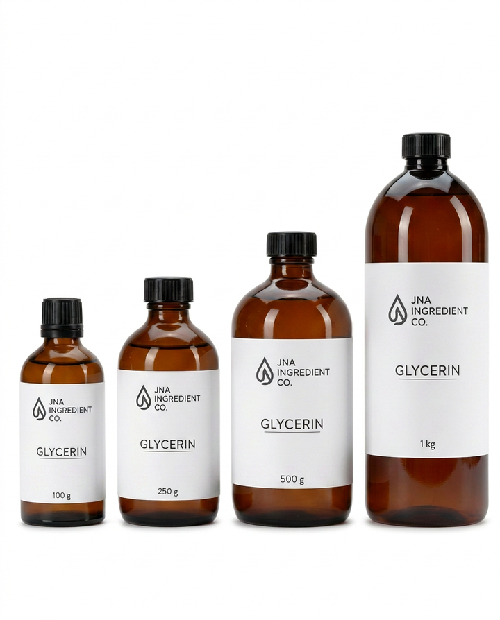 Four amber glass bottles of glycerin from JNA Ingredient Co. in graduated sizes (100 g, 250 g, 500 g, and 1 kg), arranged from smallest to largest against a plain white background.