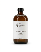 An amber glass bottle of JNA Ingredient Co. Sunflower Oil with a white label and black cap, set against a plain white background. High Oleic Sunflower Oil emollient used in soaps, creams, serums, and body care formulations
